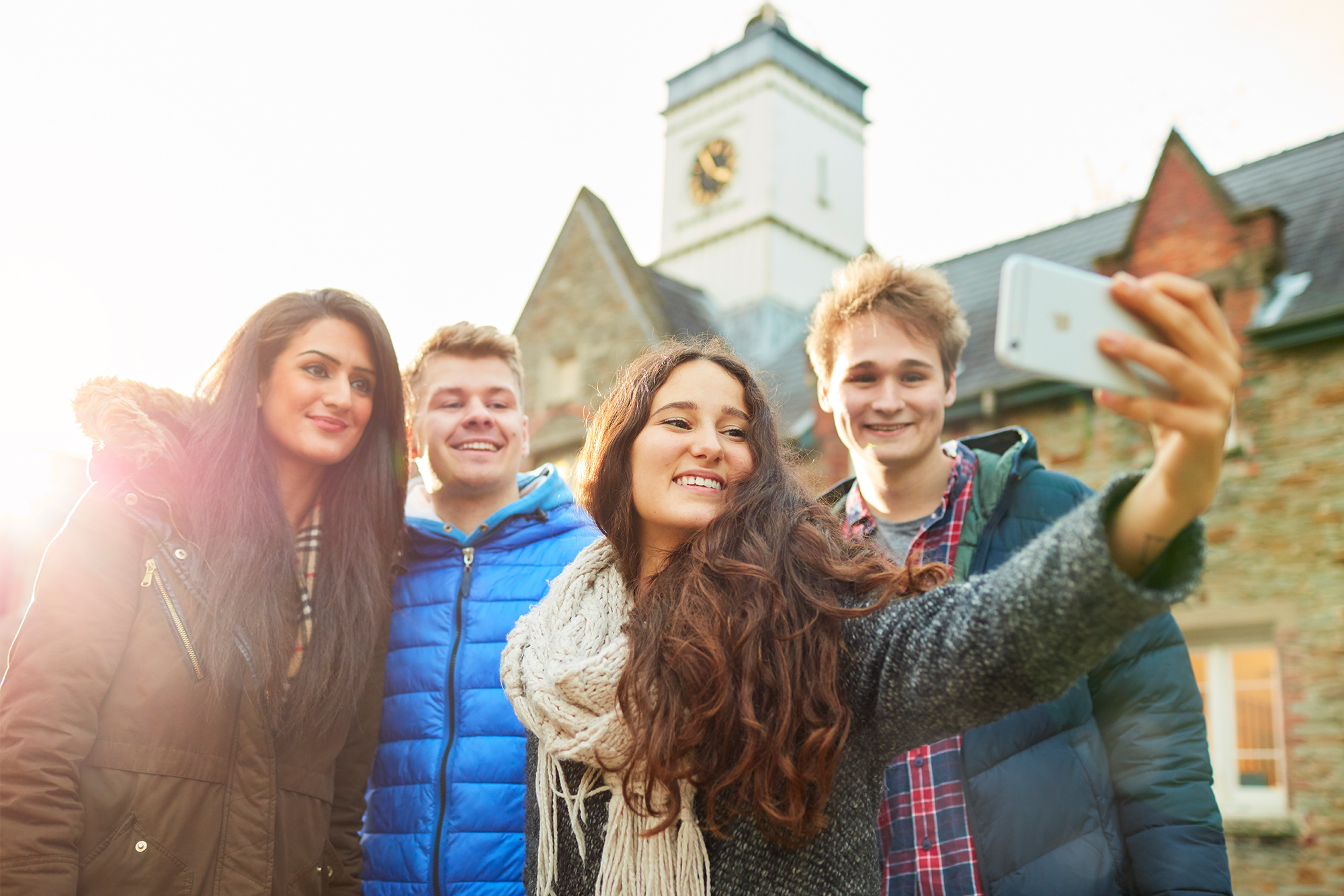 Swansea University students smiling and taking a selfie